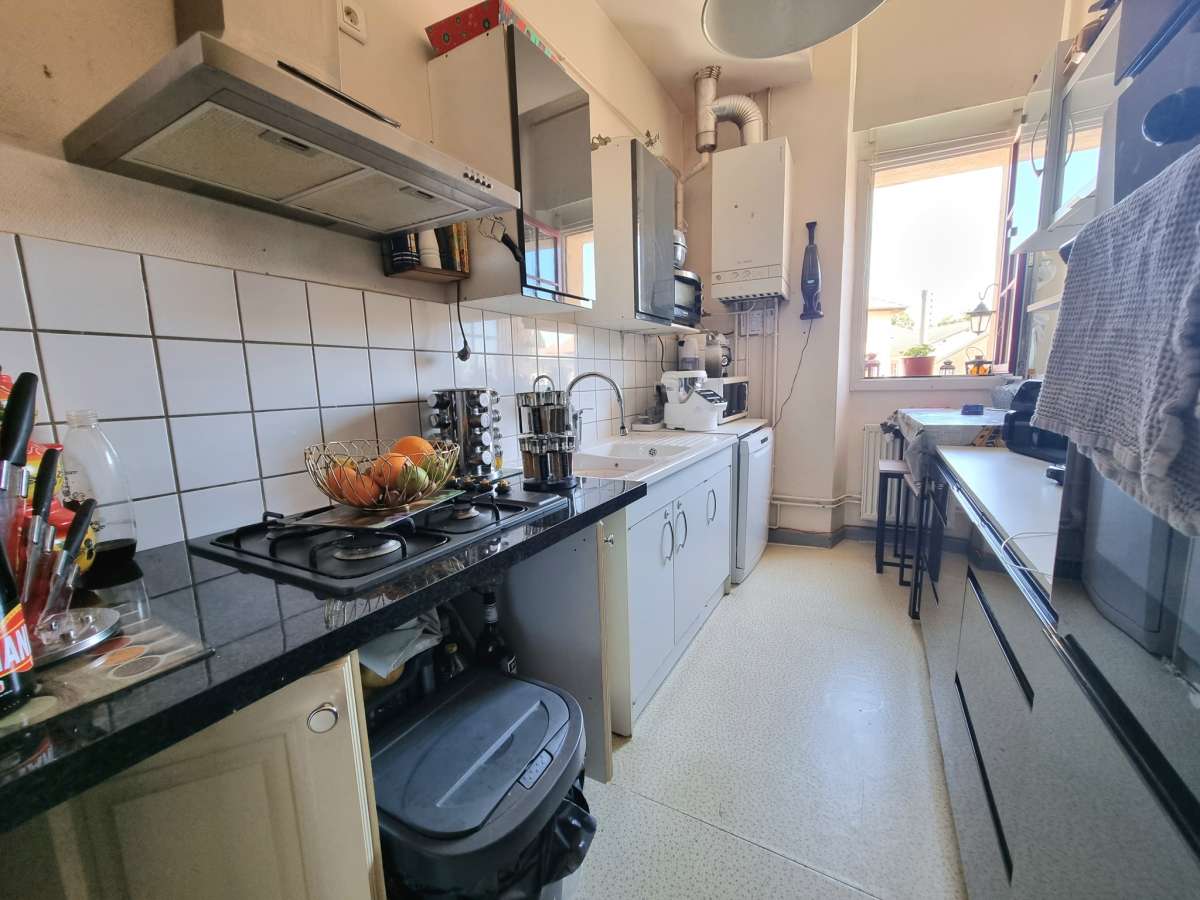 Appartement 3 pièces 90 m2 1er étage avec jardin et cave